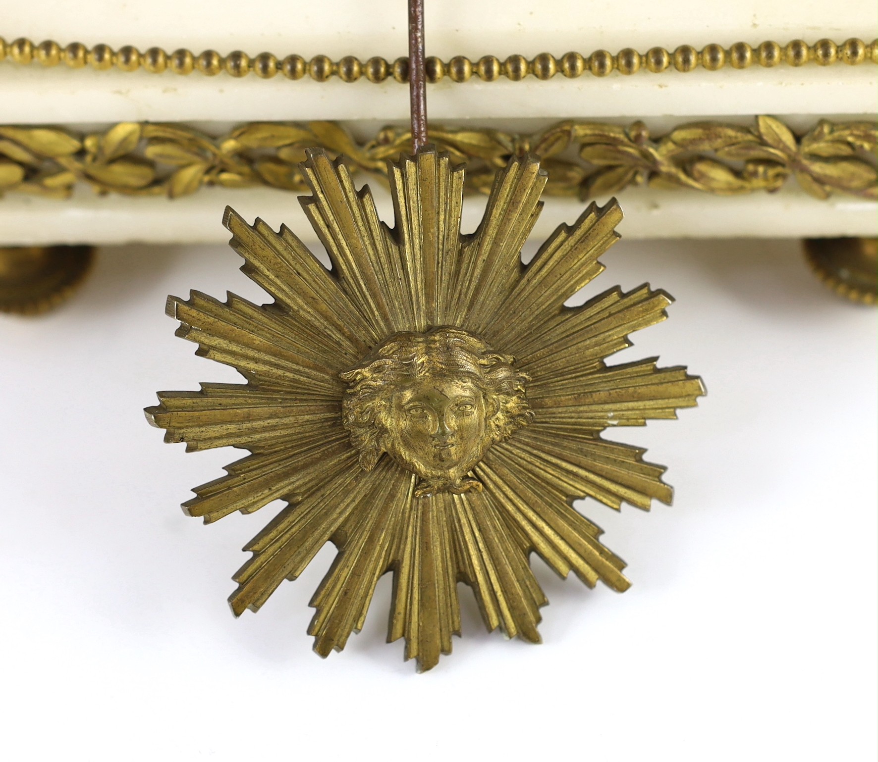 A French Louis XVI style ormolu and white marble mantel clock, 26cm wide, 48cm high